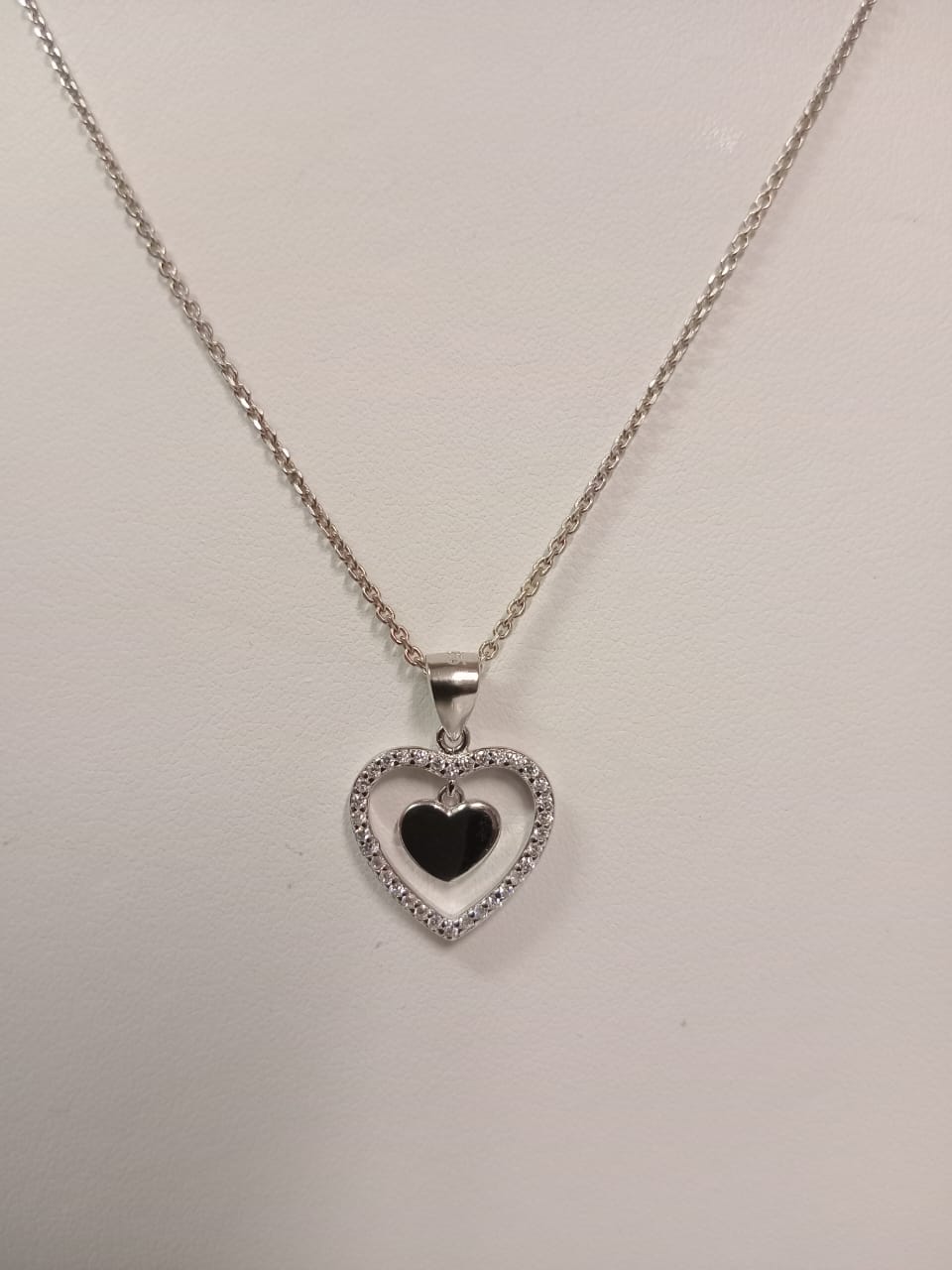 Silver Open Design Cubic Zirconia Heart Pendant With Plain Heart Disc
